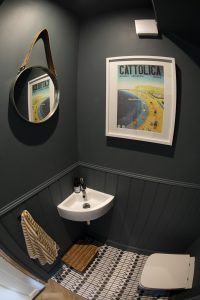 cloakroom with dark grey walls