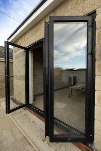 Glass doors opening from new building